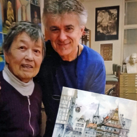 Picture of Miyoko Kusumoto and Ferenc Besze holding painting