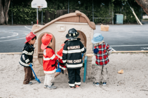 Kids dressed in costumes playing outside