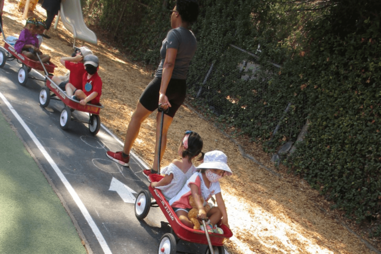 Young children riding in wagons