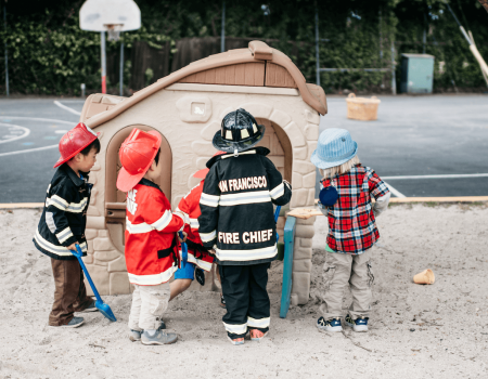 Kids dressed in costumes playing outside